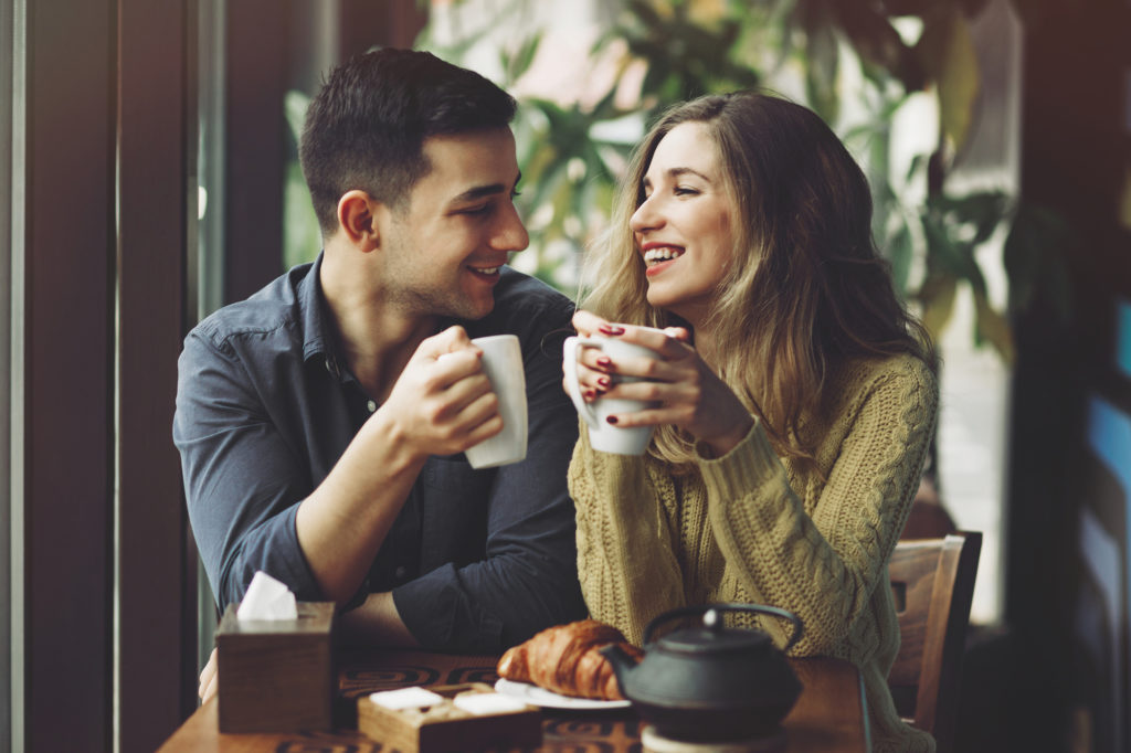 Couple drinking coffee building a love that last through resilient relationships
