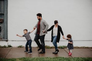 Parents handling their two children